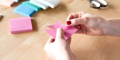 Take every other corner and fold it into the center, without creasing the paper